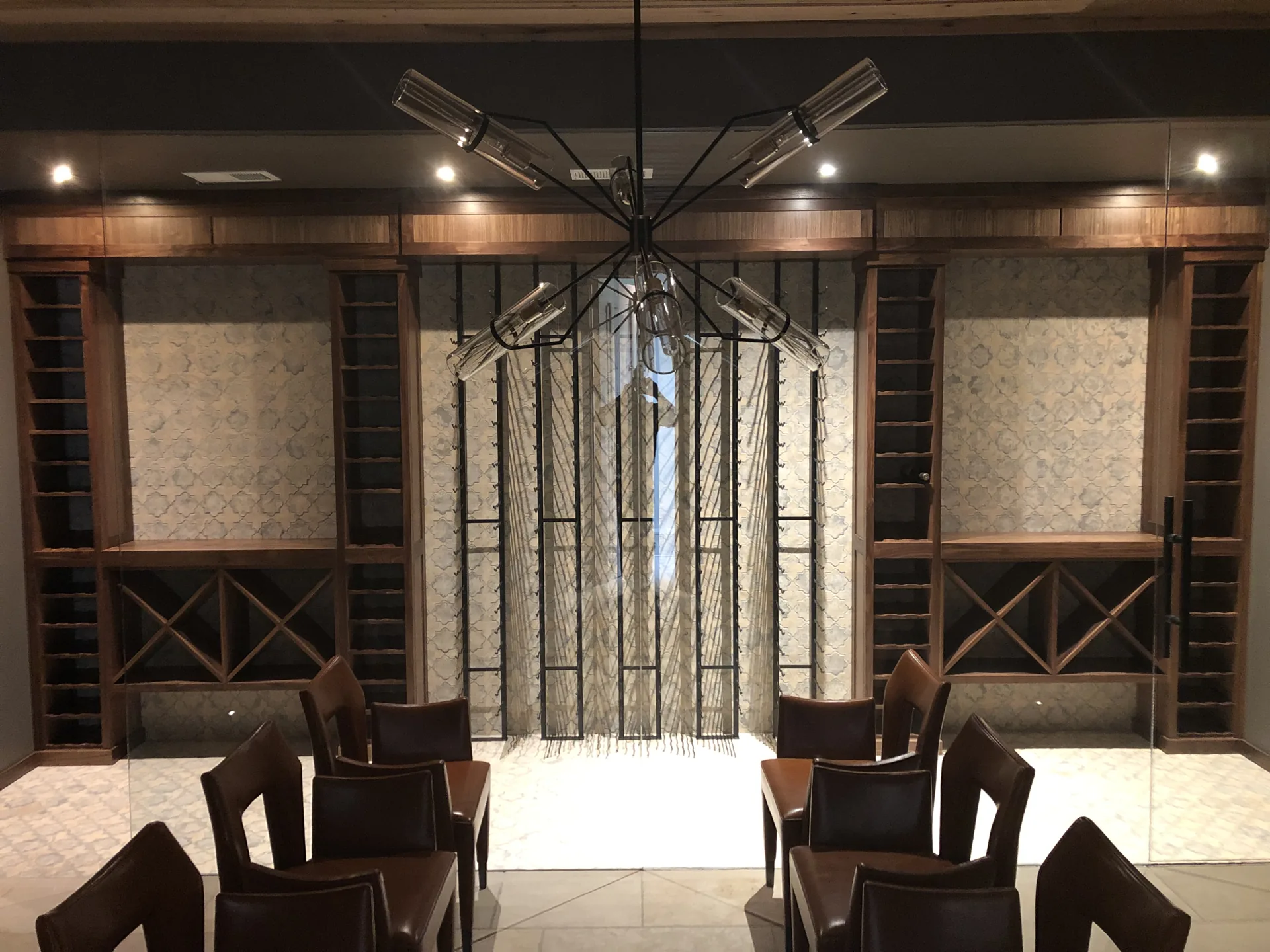 Quail Hollow cellar: walnut wood racks with metal vertical racks at the center