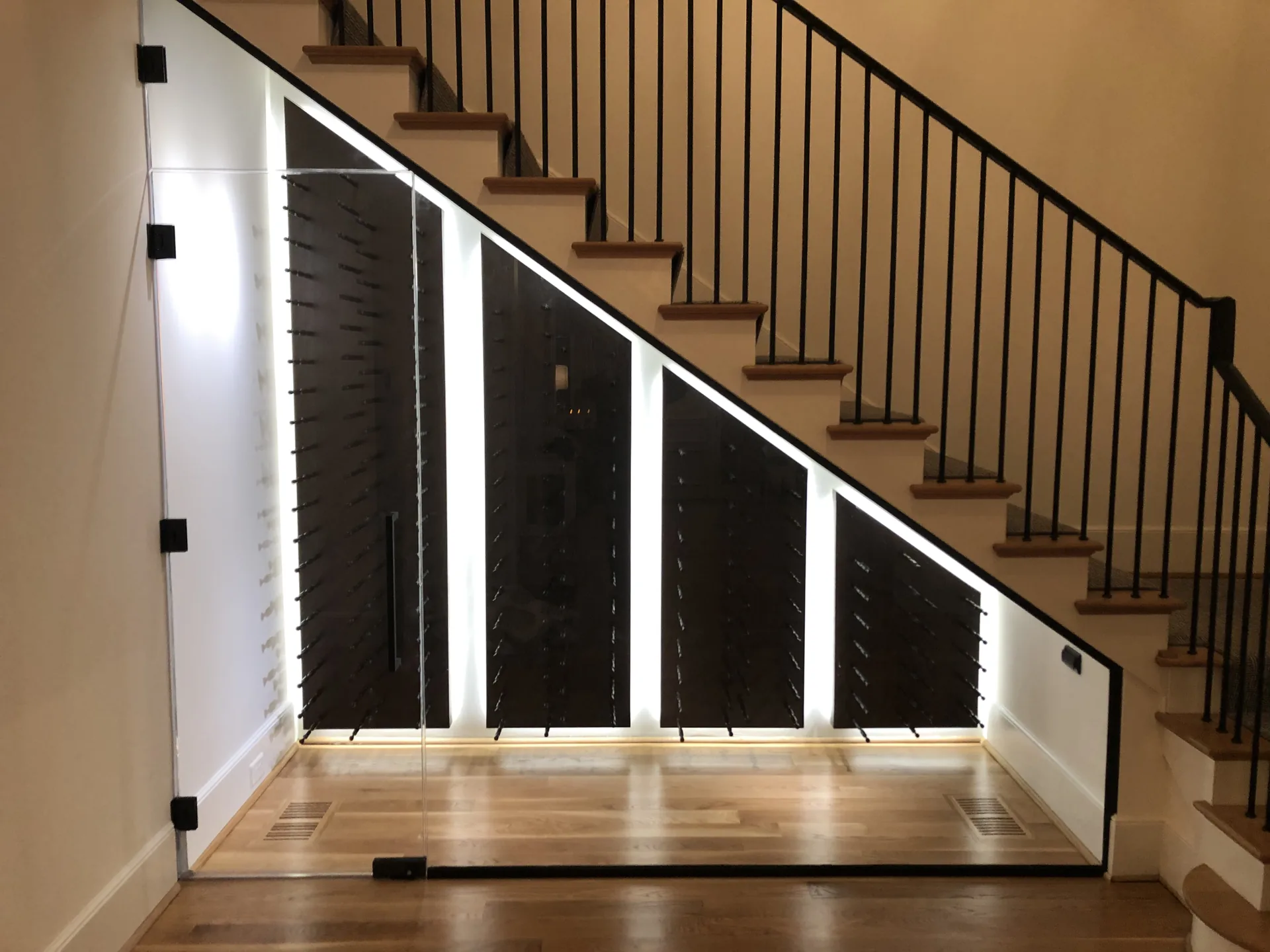 Secret Reserve cellar: stained walnut racking with black metal pegs