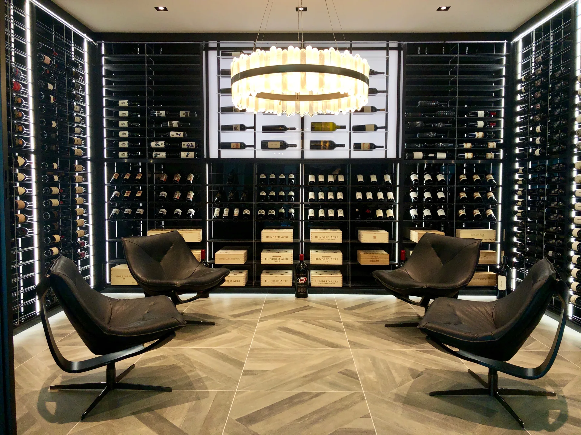 Illuminated acrylic back wall with black horizontal rods in the Sophisticate cellar